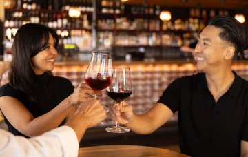 Two people drinking wine